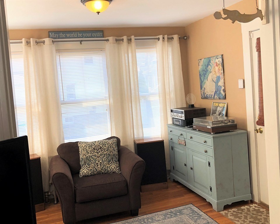 44 Sculpin Way, Unit 44 Swampscott, MA 01907 - Photo 3 of 21 a living room with furniture and a window