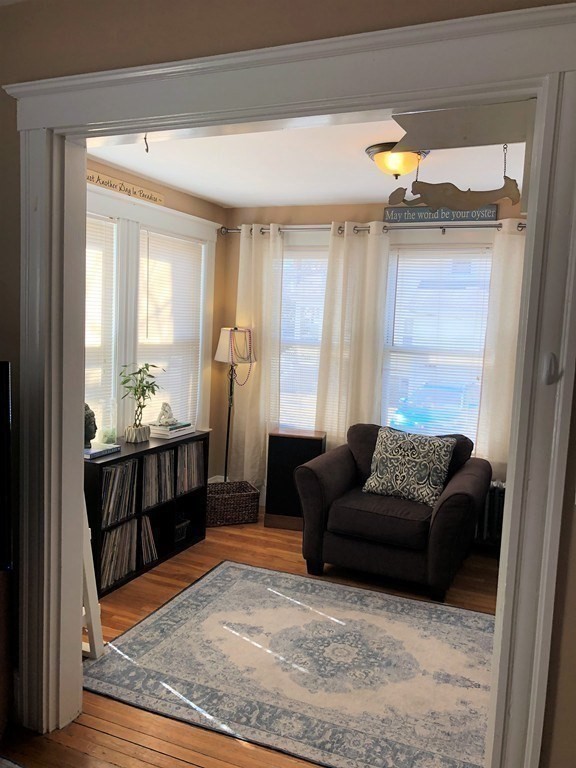 44 Sculpin Way, Unit 44 Swampscott, MA 01907 - Photo 8 of 21 a living room with furniture and a window