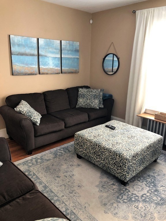 44 Sculpin Way, Unit 44 Swampscott, MA 01907 - Photo 9 of 21 a bedroom with a bed a couch and window
