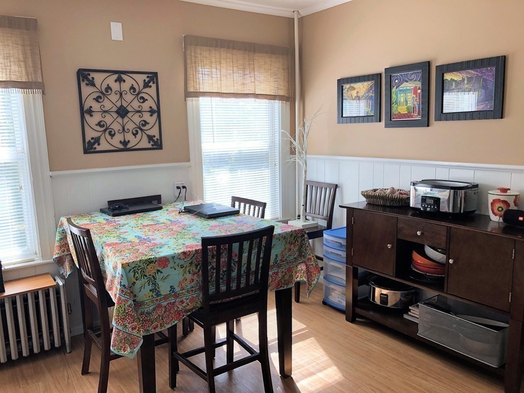 44 Sculpin Way, Unit 44 Swampscott, MA 01907 - Photo 10 of 21 a dining room with a wooden table and chairs