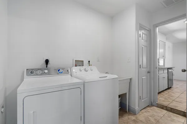 a utility room with dryer and washer
