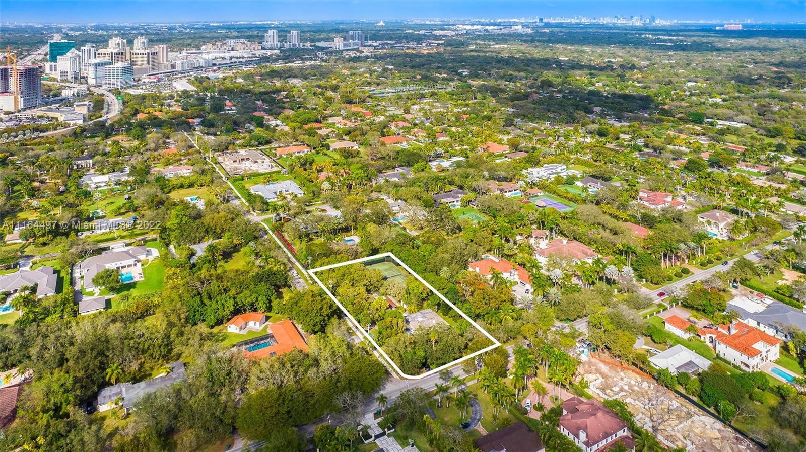 7335 Southwest 104th Street Pinecrest, FL 33156 - Photo 1 of 16 a view of city and mountain