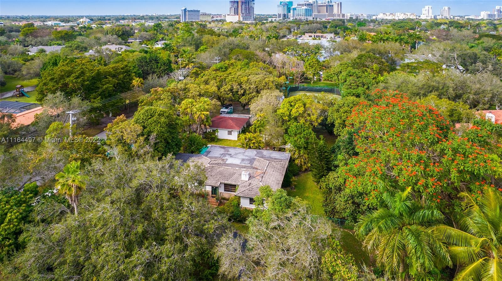 7335 Southwest 104th Street Pinecrest, FL 33156 - Photo 4 of 16 a view of a city