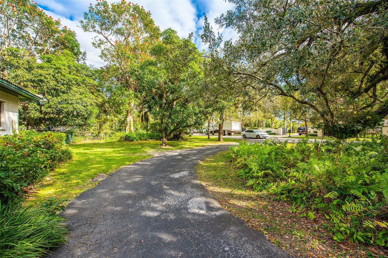 7335 Southwest 104th Street Pinecrest, FL 33156 - Photo 9 of 16 a view of outdoor space with garden