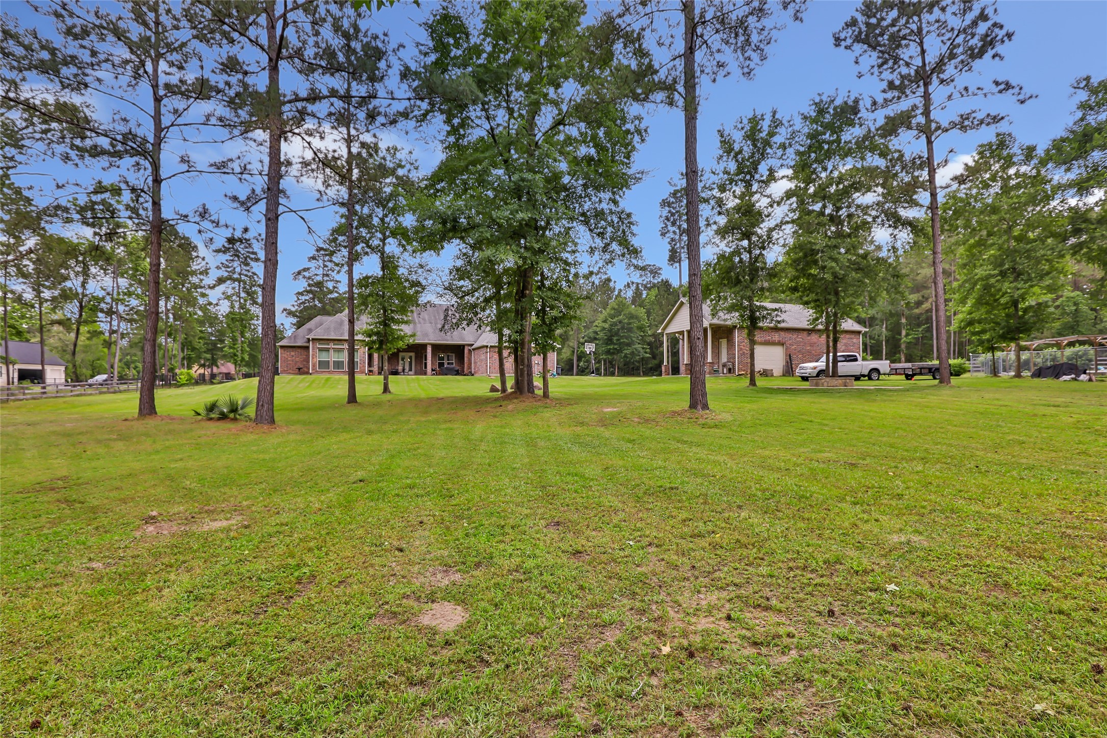 229 Sundog Road Huntsville, TX 77340 - Photo 49 of 50 Another view from the back yard to the house and extra building