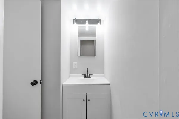 a bathroom with a sink and mirror