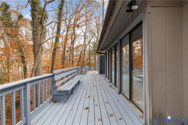 a view of balcony with wooden floor