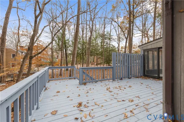 a view of wooden fence and trees