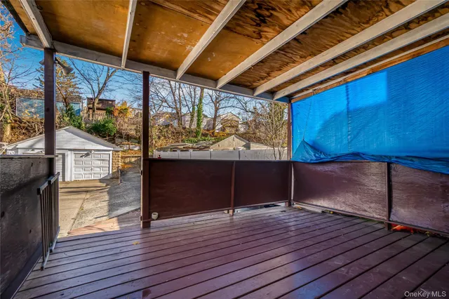 a view of outdoor space with wooden floor