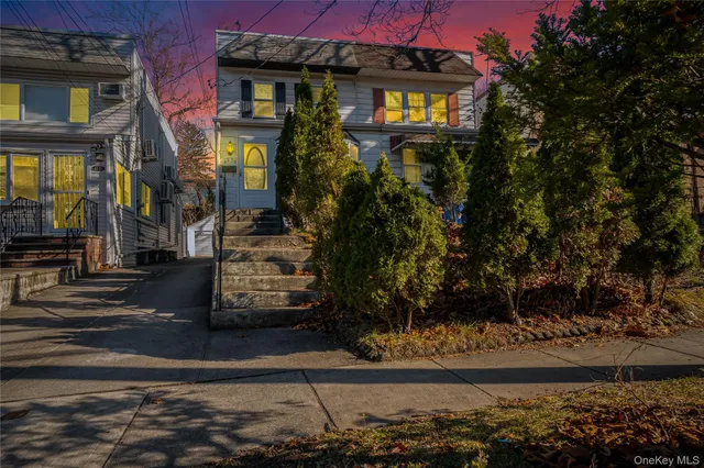 a view of a brick building with many windows