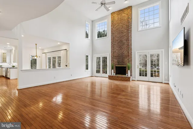a view of a kitchen with wooden floor and a kitchen
