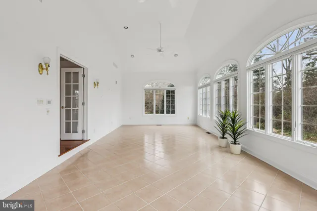 a view of an entryway with wooden floor and door