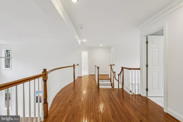 a spacious bathroom with a tub sink and mirror