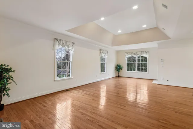 a bathroom with a shower and a glass door