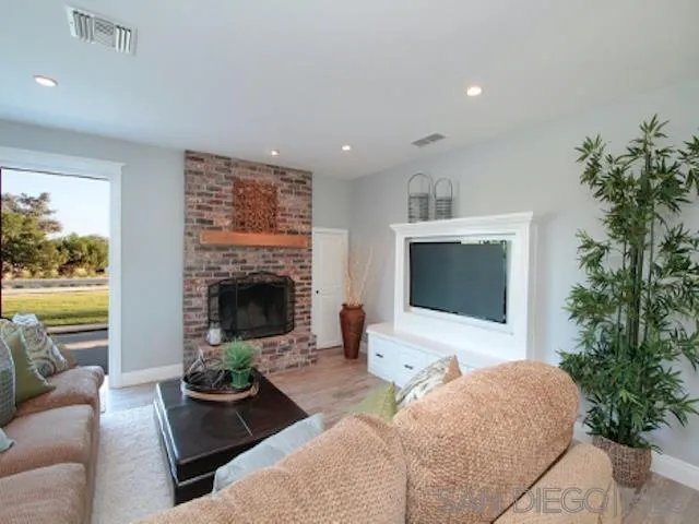 16544 Franzen Farm Road San Diego, CA 92127 - Photo 14 of 25 a living room with furniture and a fireplace