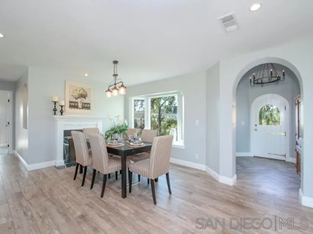 16544 Franzen Farm Road San Diego, CA 92127 - Photo 15 of 25 a view of a dining room with furniture window and wooden floor