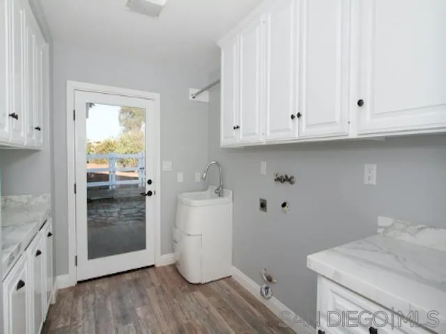 16544 Franzen Farm Road San Diego, CA 92127 - Photo 19 of 25 a view of storage and utility room with wooden floor