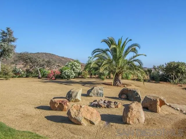 16544 Franzen Farm Road San Diego, CA 92127 - Photo 24 of 25 a view of a lake with couches and wooden floor