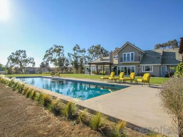 16544 Franzen Farm Road San Diego, CA 92127 - Photo 3 of 25 a view of a swimming pool with a patio and a yard