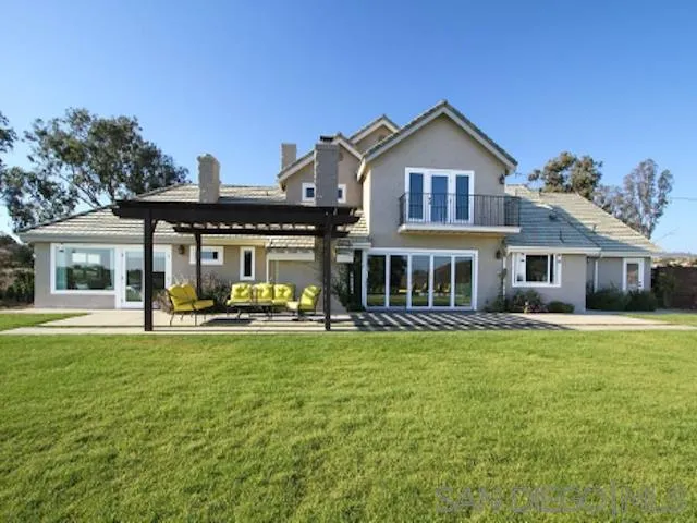 16544 Franzen Farm Road San Diego, CA 92127 - Photo 4 of 25 a front view of a house with swimming pool having outdoor seating