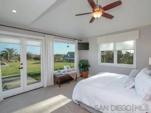 16544 Franzen Farm Road San Diego, CA 92127 - Photo 8 of 25 a bed room with a bed and a window