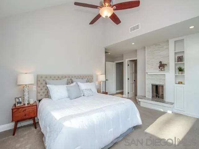 16544 Franzen Farm Road San Diego, CA 92127 - Photo 9 of 25 a bedroom with a bed and a chandelier