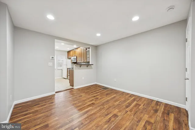 a view of a kitchen with wooden floor