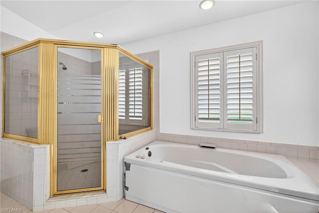 7071 Mill Pond Circle Naples, FL 34109 - Photo 13 of 24 Bathroom featuring a garden tub, a stall shower, recessed lighting, and light tile patterned floors