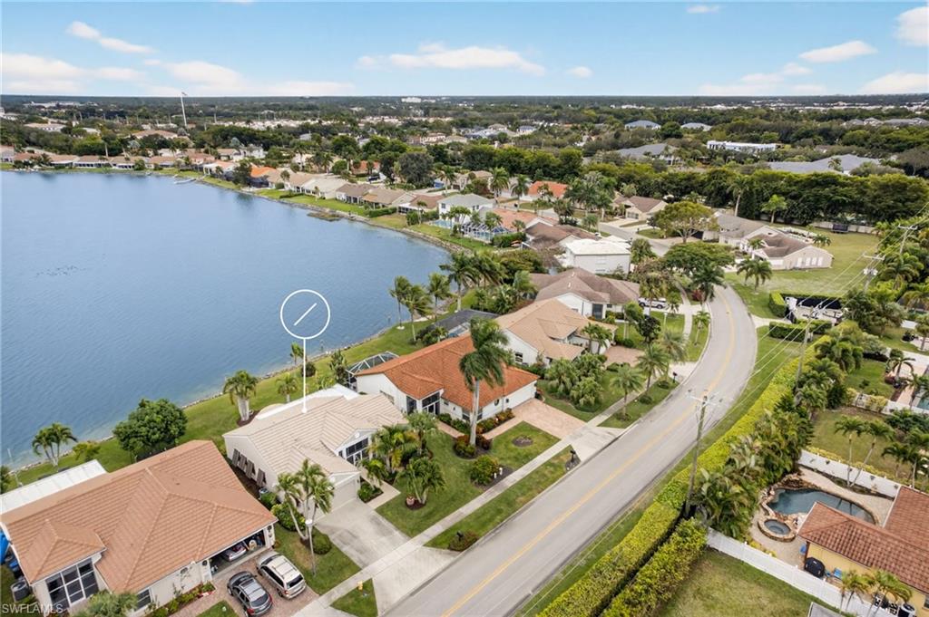 7071 Mill Pond Circle Naples, FL 34109 - Photo 23 of 24 Aerial perspective of suburban area with a nearby body of water