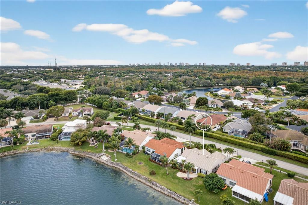 7071 Mill Pond Circle Naples, FL 34109 - Photo 24 of 24 Aerial perspective of suburban area with a nearby body of water and skyline