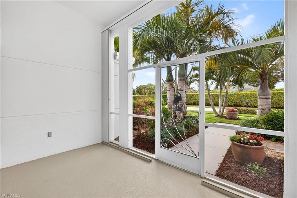 7071 Mill Pond Circle Naples, FL 34109 - Photo 3 of 24 Entryway with lofted ceiling and floor to ceiling windows