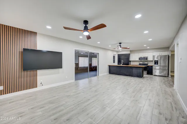 a view of a livingroom with furniture and a flat screen tv