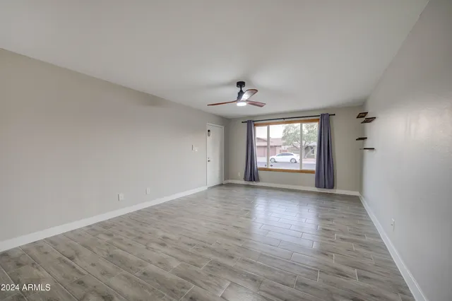 a view of an empty room with a window