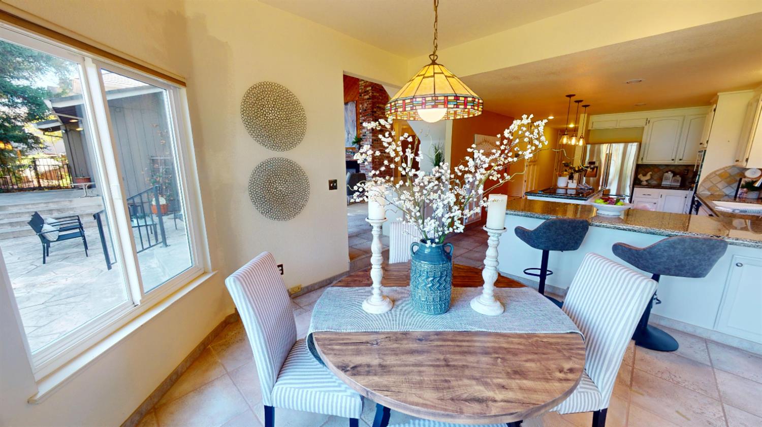 3379 Cambridge Road Cameron Park, CA 95682 - Photo 16 of 74 a view of a dining room with furniture window and wooden floor