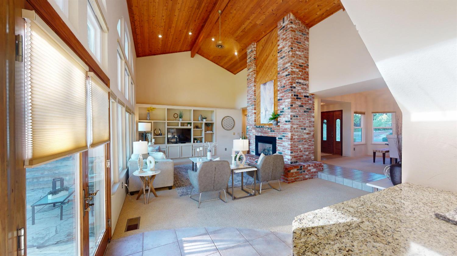 3379 Cambridge Road Cameron Park, CA 95682 - Photo 19 of 74 a living room with furniture a fireplace and potted plants