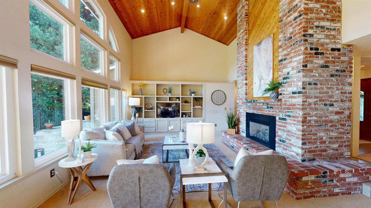 3379 Cambridge Road Cameron Park, CA 95682 - Photo 21 of 74 a living room with furniture a fireplace and a floor to ceiling window