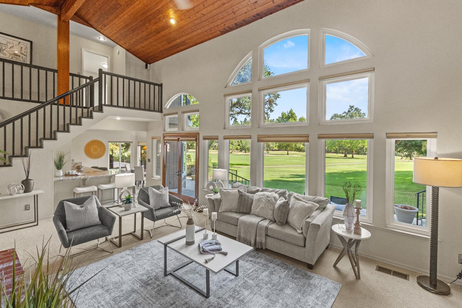 3379 Cambridge Road Cameron Park, CA 95682 - Photo 24 of 74 a living room with furniture a rug and a large window