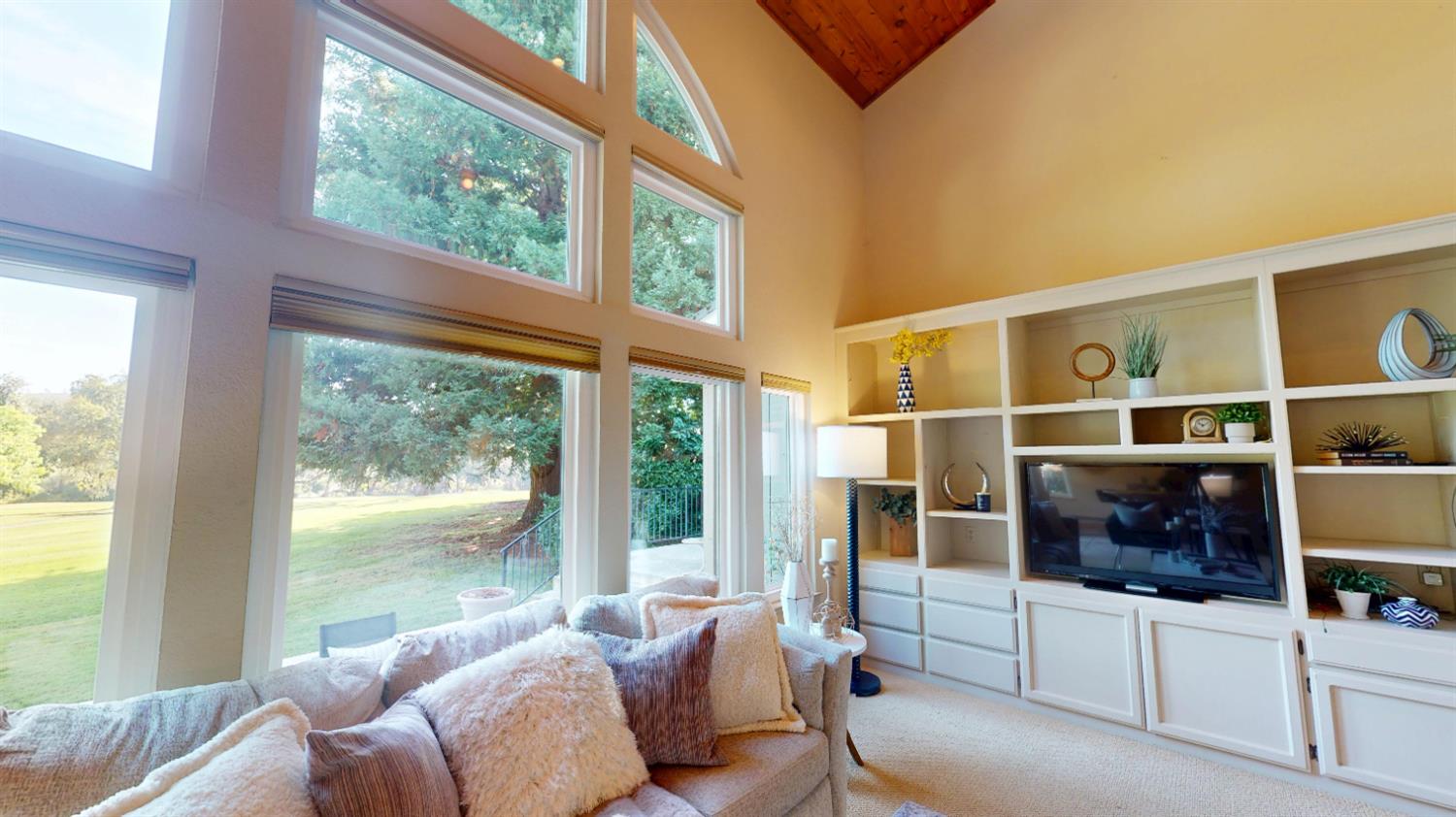 3379 Cambridge Road Cameron Park, CA 95682 - Photo 26 of 74 a living room with furniture and a flat screen tv