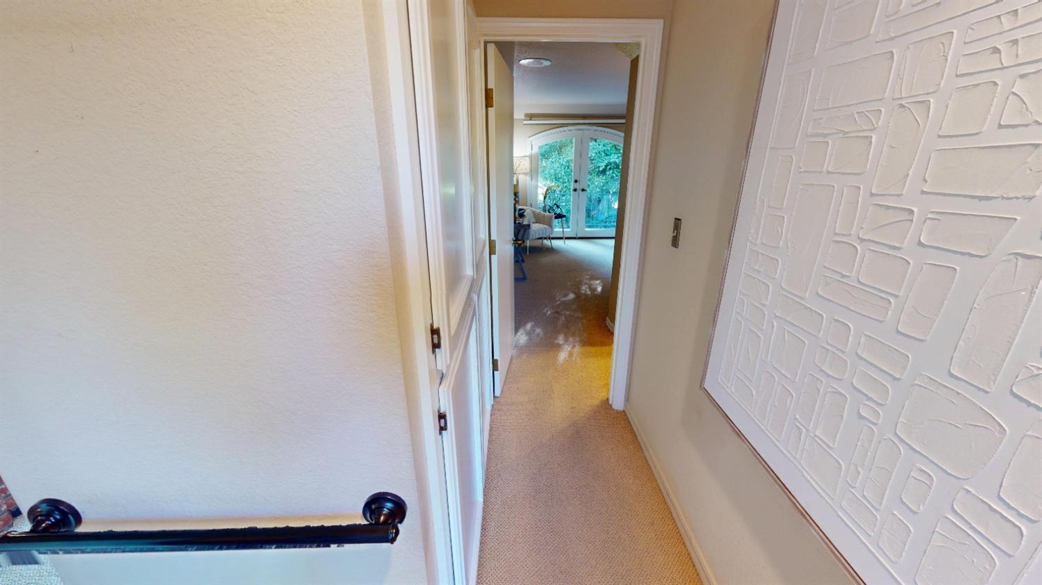 3379 Cambridge Road Cameron Park, CA 95682 - Photo 36 of 74 Bedrooms are in a split layout with the primary bedroom on the right and the other 2 bedrooms on the left side of the home. This is the small walk to the primary bedroom.