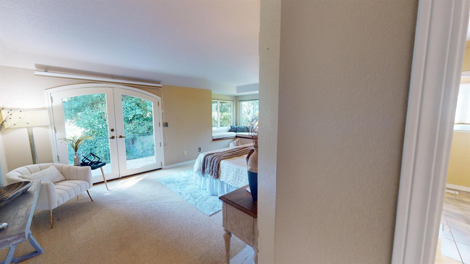 3379 Cambridge Road Cameron Park, CA 95682 - Photo 47 of 74 Primary bedroom featuring a reading nook and French doors that lead to back patio.