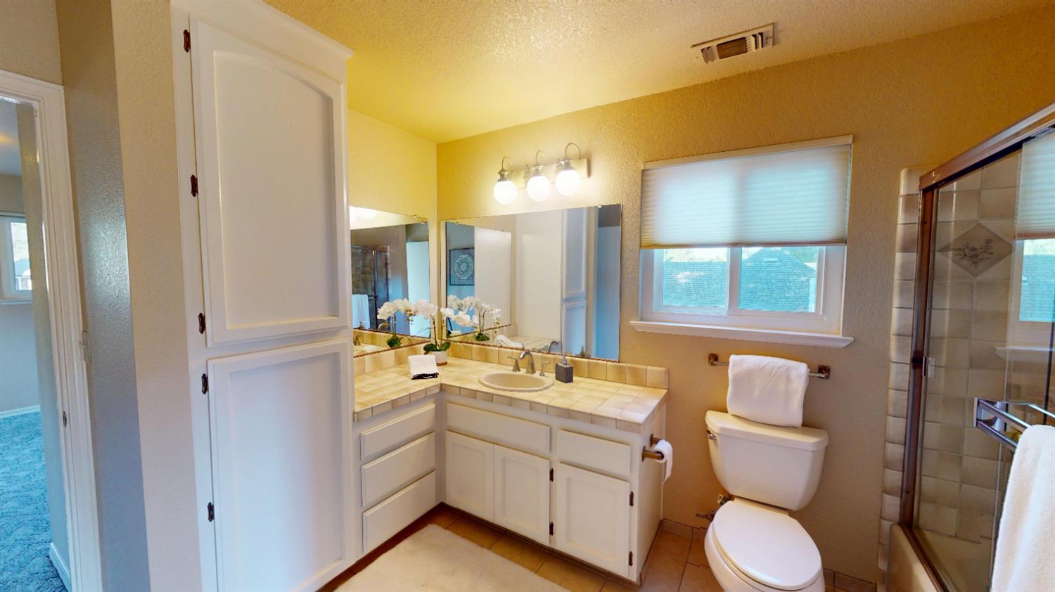 3379 Cambridge Road Cameron Park, CA 95682 - Photo 63 of 74 Upstairs the bathroom is situated between the bedrooms and is a Jack and Jill bathroom which means there are 2 doors so each bedroom can enter with their own door.