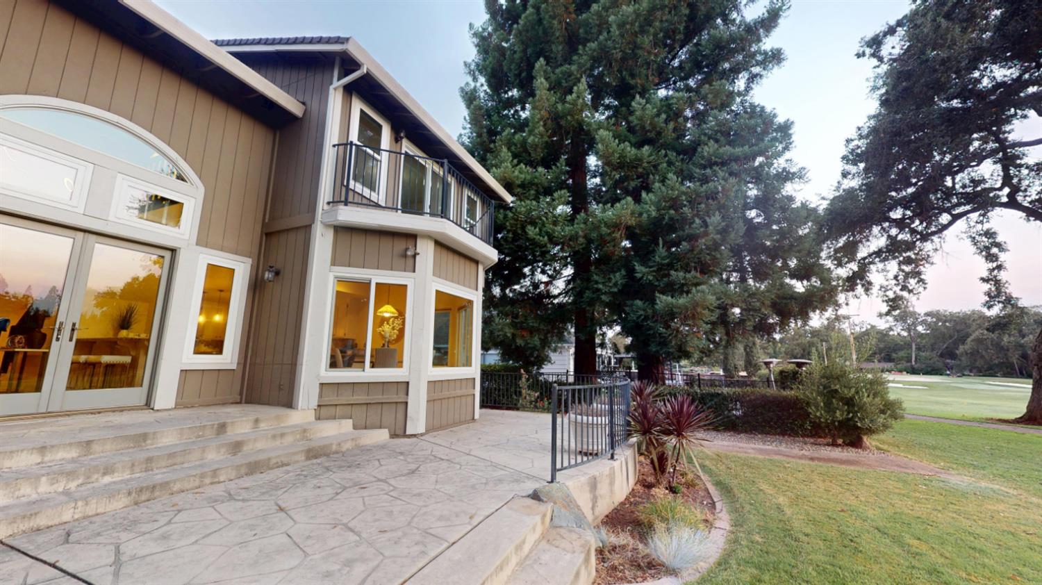 3379 Cambridge Road Cameron Park, CA 95682 - Photo 65 of 74 Exterior view of the home on the golf course side.