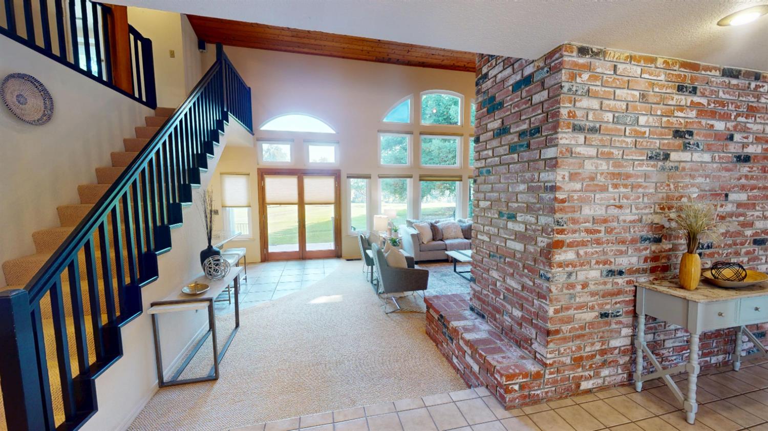3379 Cambridge Road Cameron Park, CA 95682 - Photo 8 of 74 From the foyer you enter the large living room which features large open-beam ceilings and the lots of windows with natural light.
