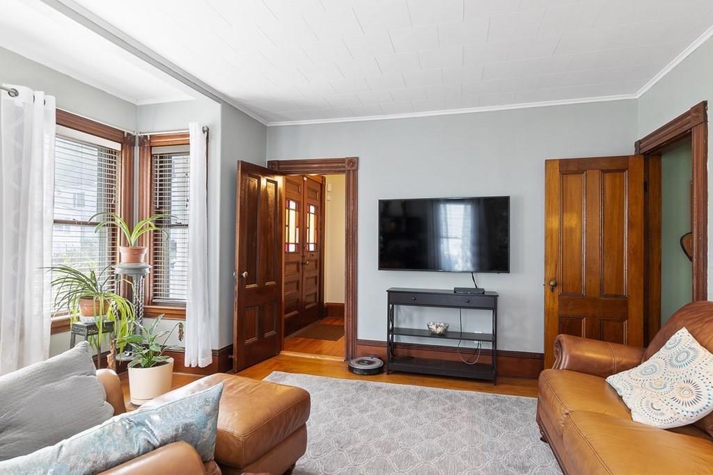 66 Manning Street Hudson, MA 01749 - Photo 11 of 40 a living room with furniture and a flat screen tv