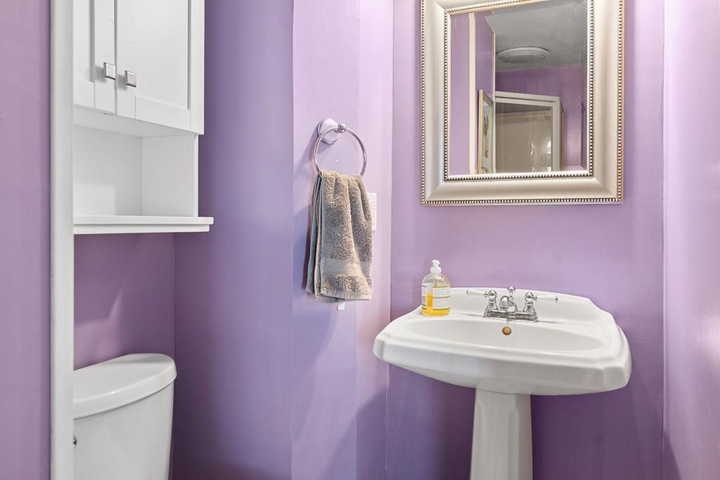 66 Manning Street Hudson, MA 01749 - Photo 14 of 40 a bathroom with a sink a toilet and mirror