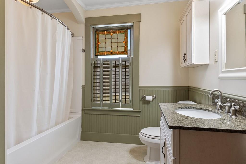 66 Manning Street Hudson, MA 01749 - Photo 17 of 40 a bathroom with a granite countertop sink toilet and mirror