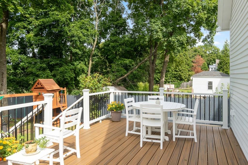66 Manning Street Hudson, MA 01749 - Photo 26 of 40 a view of a roof deck with table and chairs