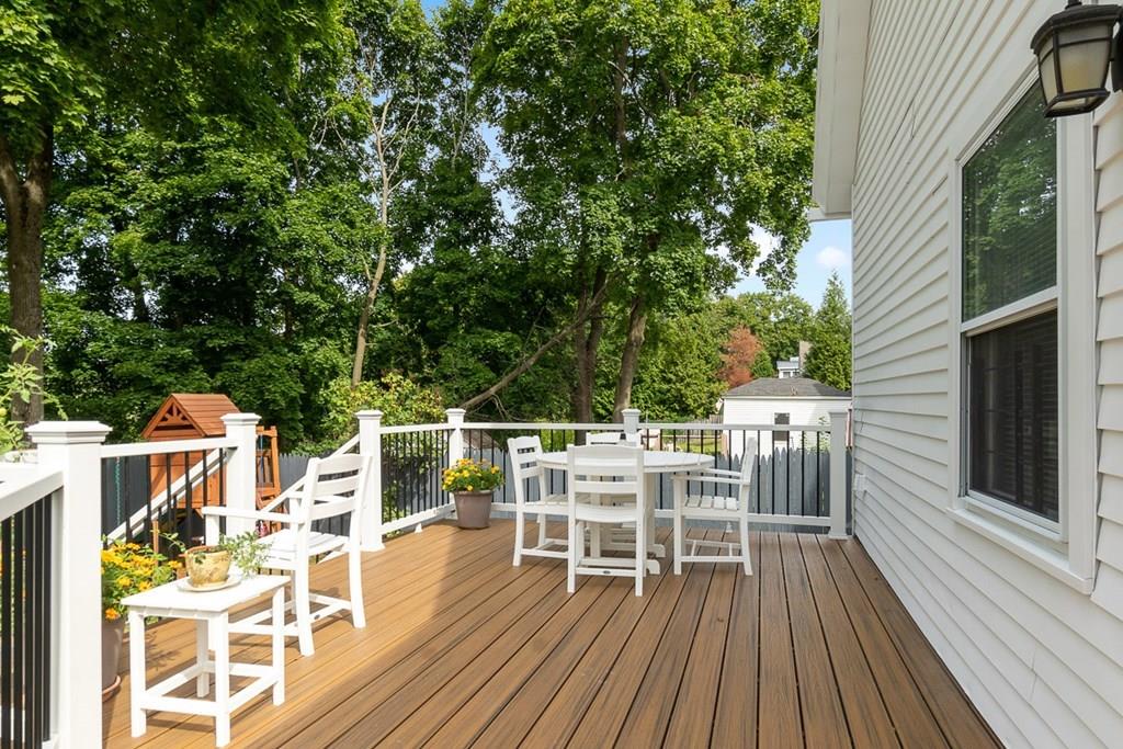 66 Manning Street Hudson, MA 01749 - Photo 27 of 40 a view of a chairs and table on the wooden deck