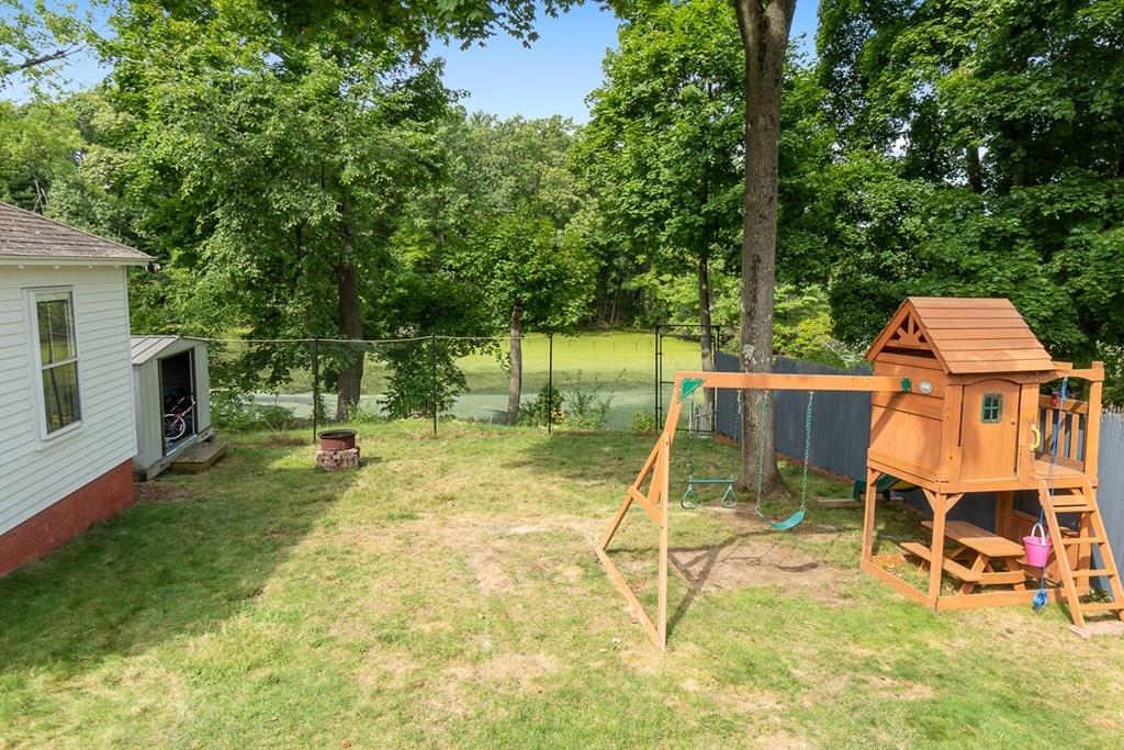 66 Manning Street Hudson, MA 01749 - Photo 31 of 40 a view of a backyard with a table and chairs