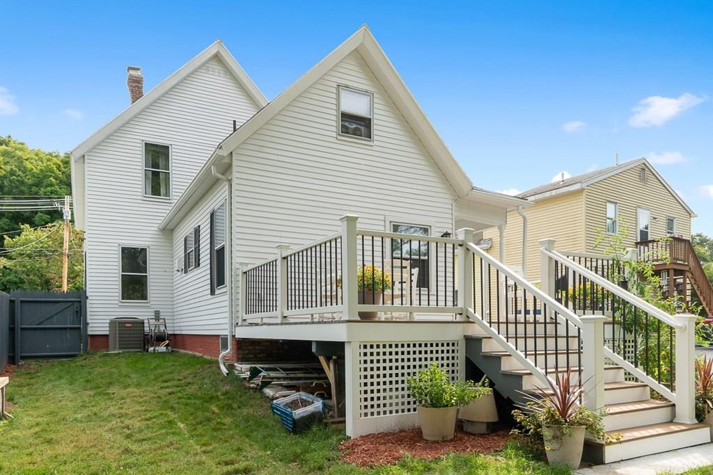 66 Manning Street Hudson, MA 01749 - Photo 33 of 40 a view of house with a yard